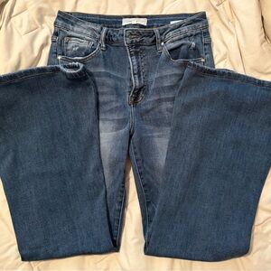 Women's Flare Risen jeans.soft and stretchy. Medium wash with lighter graining.